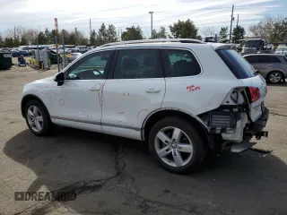2012 Volkswagen Touareg с VIN WVGEG9BP1CD007581, выставлен на аукционе Copart как лот 47958355 с пробегом 79 649 миль миль и Списание • Salvage title. История ставок и продаж доступна на DreamBid. Изображение 2.