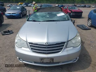 2010 Chrysler Sebring Touring z VIN 1C3BC5ED9AN201946, wystawiony jako IAAI lot #42430012 z przebiegiem 125 672 mil mil oraz . Historia ofert i sprzedaży dostępna na DreamBid. Obrazek 13.