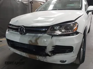 2012 Volkswagen Touareg Sport with VIN WVGFK9BP2CD002991, listed as a IAAI auction lot 42077523 with 94,515 mi miles and . Bid and sale history available at DreamBid. Image 6.