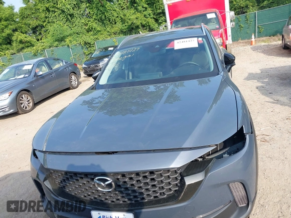 2024 Mazda CX-50 S Premium z VIN 7MMVABDM7RN231991, wystawiony jako IAAI lot #42481427 z przebiegiem 7 843 mil mil oraz . Historia ofert i sprzedaży dostępna na DreamBid. Obrazek 13.