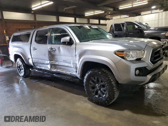 2021 Toyota Tacoma 4WD SR5 with VIN 3TMDZ5BN3MM103509, listed as a Copart auction lot 48461875 with 54,566 mi miles and Salvage Title. Bid and sale history available at carsss.com. Image 4.