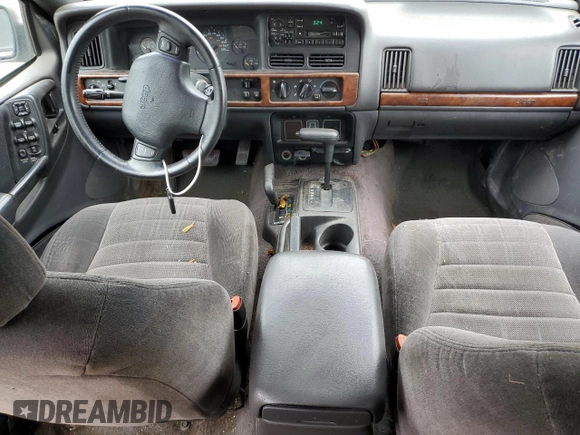 1996 Jeep Grand Cherokee Laredo with VIN 1J4GZ58S7TC403946, listed as a Copart auction lot 71785734 with 231,780 mi miles and Salvage Title. Bid and sale history available at carsss.com. Image 8.