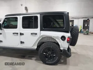 2023 Jeep Wrangler Sport S with VIN 1C4HJXDN2PW632584, listed as a IAAI auction lot 41965191 with 20,288 mi miles and . Bid and sale history available at DreamBid. Image 6.