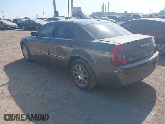 2009 Chrysler 300 Touring with VIN 2C3LA53V09H520923, listed as a IAAI auction lot 40408803 with 216,747 mi miles. Bid and sale history available at carsss.com. Image 3.