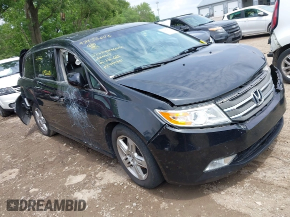 2012 Honda Odyssey Touring with VIN 5FNRL5H91CB121950, listed as a IAAI auction lot 42456620 with 200,831 mi miles and . Bid and sale history available at DreamBid. Image 1.