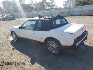 1987 Oldsmobile Toronado with VIN 1G3EZ1130HU307201, listed as a Copart auction lot 78028584 with 104,837 mi miles and Salvage Title. Bid and sale history available at DreamBid. Image 2.