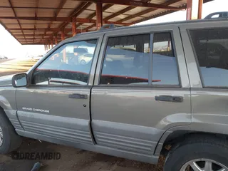 1998 Jeep Grand Cherokee Laredo with VIN 1J4GZ58S9WC136684, listed as a IAAI auction lot 41444103 with 1 mi miles. Bid and sale history available at carsss.com. Image 13.