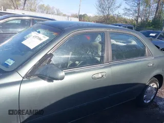 1998 Mazda 626 DX with VIN 1YVGF22C4W5768778, listed as a IAAI auction lot 41971066 with 119,168 mi miles. Bid and sale history available at carsss.com. Image 14.