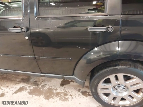 2011 Dodge Nitro Heat with VIN 1D4PU4GX0BW517654, listed as a IAAI auction lot 41715627 with 107,954 mi miles. Bid and sale history available at carsss.com. Image 6.