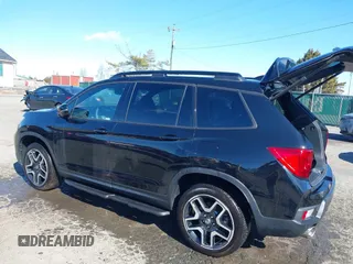 2023 Honda Passport Elite with VIN 5FNYF8H04PB006514, listed as a IAAI auction lot 41537826 with 14,640 mi miles and . Bid and sale history available at DreamBid. Image 3.