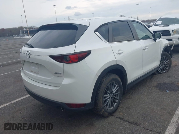 2017 Mazda CX-5 Touring with VIN JM3KFACL5H0189296, listed as a IAAI auction lot 42042328 with 60,208 mi miles and . Bid and sale history available at carsss.com. Image 4.