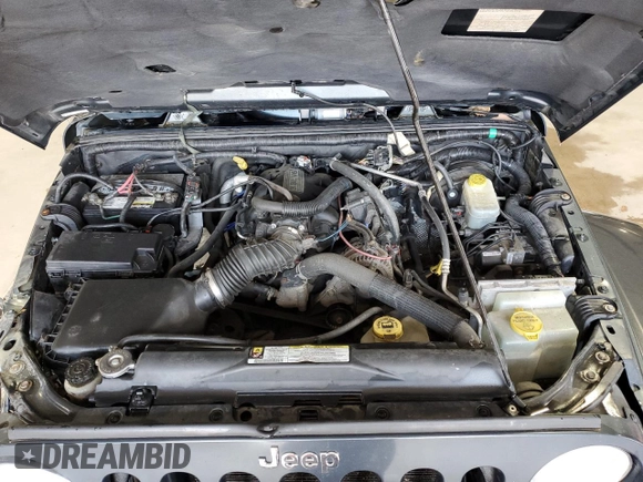 2007 Jeep Wrangler Unlimited Sahara с VIN 1J8GA591X7L217299, выставлен на аукционе Copart как лот 61984395 с пробегом 151 171 миль миль и Списание • Salvage title. История ставок и продаж доступна на DreamBid. Изображение 11.