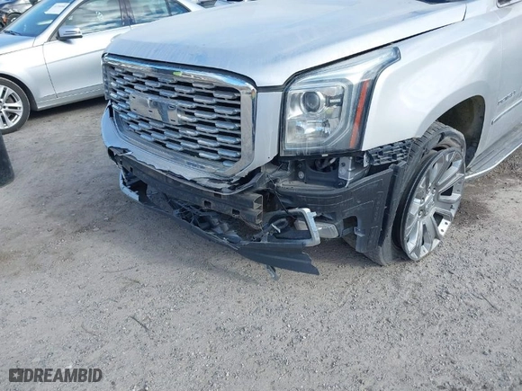 2016 GMC Yukon Denali with VIN 1GKS2CKJ1GR291872, listed as a IAAI auction lot 41169434 with 137,009 mi miles. Bid and sale history available at carsss.com. Image 6.