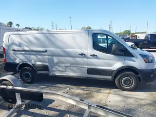 2023 Ford Transit Cargo with VIN 1FTBR1Y82PKA22661, listed as a IAAI auction lot 41768039 with 30,800 mi miles and . Bid and sale history available at DreamBid. Image 14.
