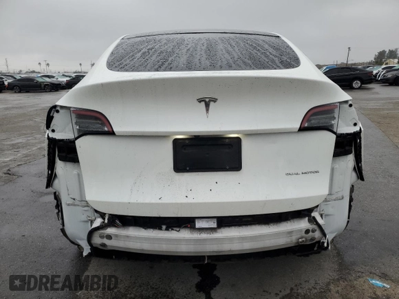 2020 Tesla Model Y Long Range with VIN 5YJYGDEE5LF053938, listed as a Copart auction lot 43381985 with 69,291 mi miles and Salvage Title. Bid and sale history available at DreamBid. Image 6.