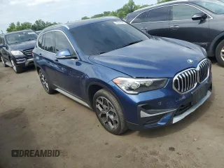 2021 BMW X1 xDrive28i with VIN WBXJG9C0XM5U47141, listed as a Copart auction lot 60645865 with 56,106 mi miles and Salvage title. Bid and sale history available at DreamBid. Image 4.