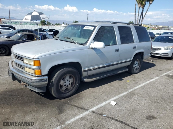 1995 Chevrolet Tahoe with VIN 1GNEK13K6SJ415105, listed as a Copart auction lot 65960124 with 219,821 mi miles and Salvage Title. Bid and sale history available at carsss.com. Image 1.