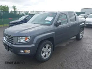2014 Honda Ridgeline RTL with VIN 5FPYK1F5XEB011772, listed as a IAAI auction lot 42440390 with 145,219 mi miles and . Bid and sale history available at DreamBid. Image 2.