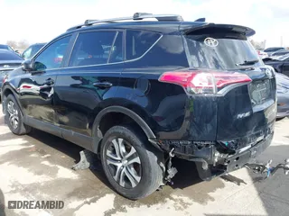 2018 Toyota RAV4 LE with VIN 2T3ZFREV9JW457062, listed as a IAAI auction lot 41696609 with 96,716 mi miles. Bid and sale history available at carsss.com. Image 3.