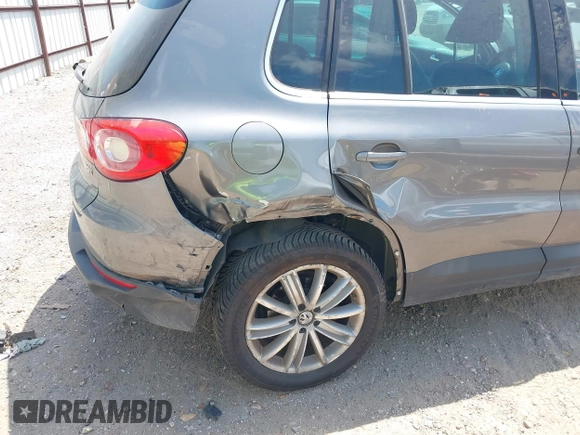 2011 Volkswagen Tiguan SEL w/Premium Navi with VIN WVGAV7AX0BW550059, listed as a IAAI auction lot 42071719 with 107,341 mi miles and . Bid and sale history available at DreamBid. Image 6.