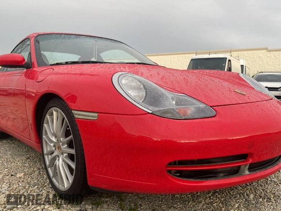 1999 Porsche 911 z VIN WP0AA2991XS620689, wystawiony jako Copart lot #59999925 z przebiegiem 152 508 mil mil oraz Czysty tytuł • Clean title. Historia ofert i sprzedaży dostępna na DreamBid. Obrazek 1.