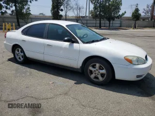 2006 Ford Taurus SE with VIN 1FAFP53U96A104173, listed as a Copart auction lot 59624865 with 145,005 mi miles and Salvage title. Bid and sale history available at DreamBid. Image 4.