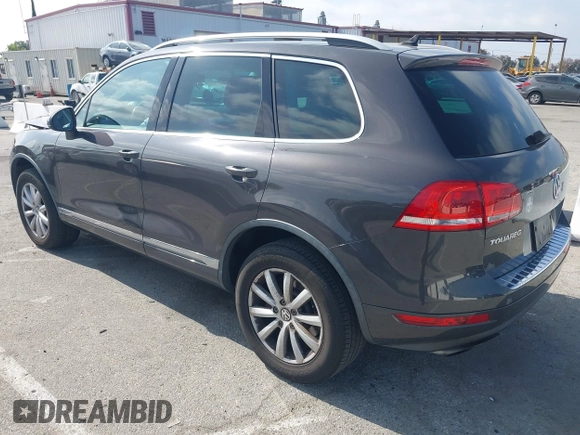 2011 Volkswagen Touareg Sport with VIN WVGFF9BP3BD002517, listed as a IAAI auction lot 42174143 with 156,337 mi miles and . Bid and sale history available at DreamBid. Image 3.