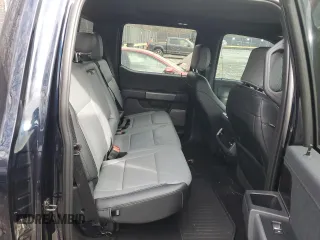 2023 Ford F-150 Lightning Pro z VIN 1FT6W1EV2PWG06829, wystawiony jako Copart lot #45875915 z przebiegiem 30 021 mil mil oraz Szkoda całkowita • Salvage title. Historia ofert i sprzedaży dostępna na DreamBid. Obrazek 11.