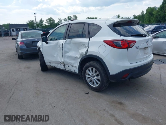 2014 Mazda CX-5 Touring z VIN JM3KE4CY9E0373359, wystawiony jako IAAI lot #42209277 z przebiegiem 106 493 mil mil oraz . Historia ofert i sprzedaży dostępna na DreamBid. Obrazek 3.