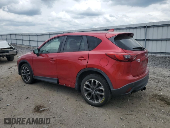 2016 Mazda CX-5 Grand Touring with VIN JM3KE4DY0G0664379, listed as a Copart auction lot 54659005 with 116,022 mi miles and Salvage Title. Bid and sale history available at DreamBid. Image 2.