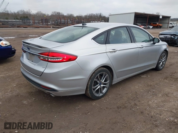 2017 Ford Fusion SE z VIN 3FA6P0H78HR174956, wystawiony jako IAAI lot #41258610 z przebiegiem 70 180 mil mil oraz . Historia ofert i sprzedaży dostępna na DreamBid. Obrazek 4.