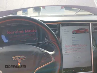 2014 Tesla Model S 60 z VIN 5YJSA1H16EFP42727, wystawiony jako IAAI lot #42544475 z przebiegiem 166 877 mil mil oraz . Historia ofert i sprzedaży dostępna na DreamBid. Obrazek 7.