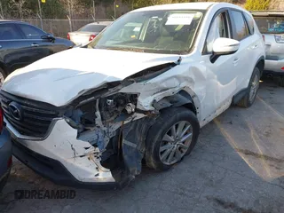 2016 Mazda CX-5 Touring z VIN JM3KE2CY9G0807688, wystawiony jako IAAI lot #41039438 z przebiegiem 169 483 mil mil oraz . Historia ofert i sprzedaży dostępna na DreamBid. Obrazek 18.