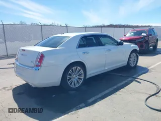 2011 Chrysler 300 with VIN 2C3CA6CTXBH559626, listed as a IAAI auction lot 41876062 with 112,045 mi miles. Bid and sale history available at carsss.com. Image 4.
