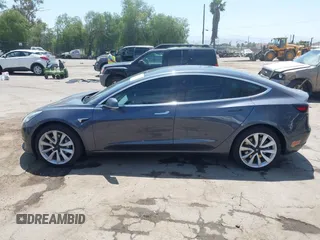 2020 Tesla Model 3 Standard Range Plus with VIN 5YJ3E1EAXLF615781, listed as a IAAI auction lot 42068935 with 96,026 mi miles. Bid and sale history available at carsss.com. Image 14.