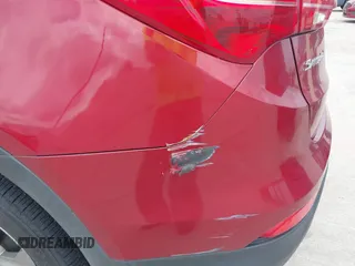 2016 Hyundai Santa Fe z VIN 5XYZT3LB1GG321854, wystawiony jako IAAI lot #40244942 z przebiegiem Nie podano mil oraz . Historia ofert i sprzedaży dostępna na DreamBid. Obrazek 13.