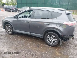 2017 Toyota RAV4 LE with VIN 2T3BFREV5HW603663, listed as a IAAI auction lot 42221653 with 102,734 mi miles and . Bid and sale history available at DreamBid. Image 3.