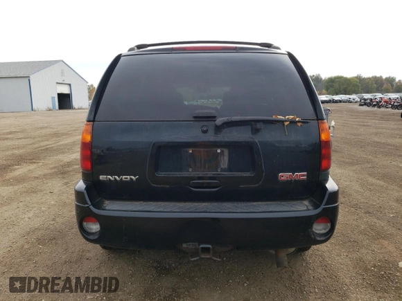 2007 GMC Envoy SLT with VIN 1GKDT13S972197393, listed as a Copart auction lot 77958764 with 151,586 mi miles and Salvage Title. Bid and sale history available at DreamBid. Image 6.