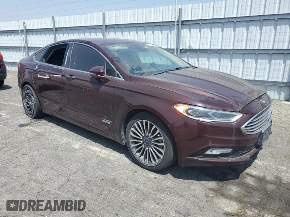 2017 Ford Fusion Titanium z VIN 3FA6P0SU8HR313773, wystawiony jako Copart lot #58791695 z przebiegiem 141 777 mil mil oraz Czysty tytuł • Clean title. Historia ofert i sprzedaży dostępna na DreamBid. Obrazek 4.