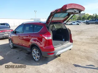 2014 Ford Escape Titanium with VIN 1FMCU0J91EUE12034, listed as a IAAI auction lot 42027493 with 160,417 mi miles and . Bid and sale history available at DreamBid. Image 3.