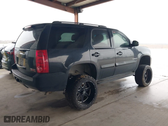 2007 GMC Yukon SLE w/3SA with VIN 1GKFC13C27R307371, listed as a IAAI auction lot 41569424 with 355,074 mi miles. Bid and sale history available at carsss.com. Image 4.