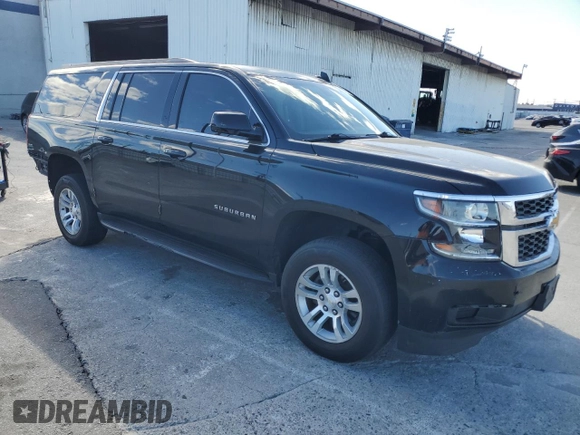 2017 Chevrolet Suburban LS with VIN 1GNSCGECXHR351539, listed as a Copart auction lot 87070214 with 246,129 mi miles and Salvage title. Bid and sale history available at DreamBid. Image 4.