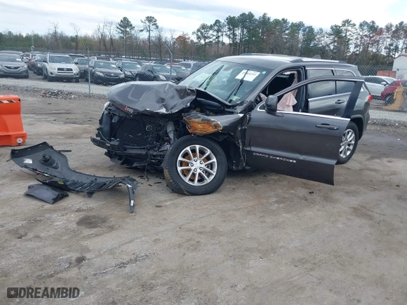 2014 Jeep Grand Cherokee Laredo with VIN 1C4RJEAG1EC573704, listed as a IAAI auction lot 41864355 with 141,970 mi miles. Bid and sale history available at carsss.com. Image 18.