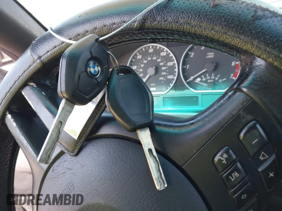 2001 BMW 3 Series 330Ci with VIN WBABS53431EV86967, listed as a IAAI auction lot 42017677 with 198,944 mi miles. Bid and sale history available at carsss.com. Image 11.