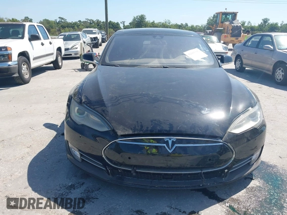 2014 Tesla Model S P85D with VIN 5YJSA1H25EFP65571, listed as a IAAI auction lot 42185442 with 115,990 mi miles and . Bid and sale history available at DreamBid. Image 6.