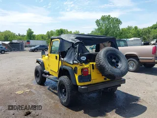 2005 Jeep Wrangler Sport z VIN 1J4FA49S65P381798, wystawiony jako IAAI lot #42305109 z przebiegiem 71 880 mil mil oraz . Historia ofert i sprzedaży dostępna na DreamBid. Obrazek 6.