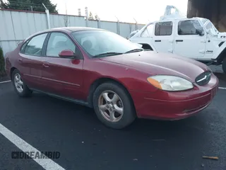 2002 Ford Taurus SE Standard z VIN 1FAFP53U32G242170, wystawiony jako IAAI lot #41299039 z przebiegiem 99 928 mil mil oraz . Historia ofert i sprzedaży dostępna na DreamBid. Obrazek 1.