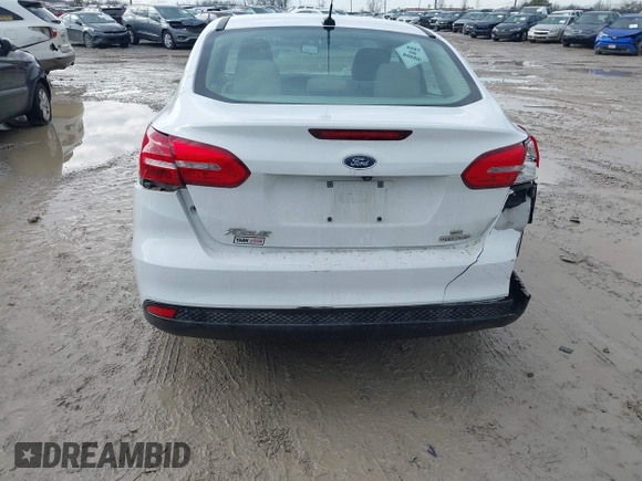 2016 Ford Focus SE z VIN 1FADP3F23GL343651, wystawiony jako IAAI lot #41668112 z przebiegiem 120 891 mil mil oraz . Historia ofert i sprzedaży dostępna na DreamBid. Obrazek 6.