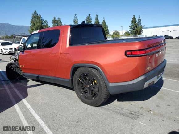 2023 Rivian R1T Adventure with VIN 7FCTGAAA0PN024599, listed as a Copart auction lot 50269955 with 0 mi miles and Salvage Title. Bid and sale history available at carsss.com. Image 2.