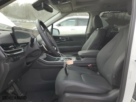 2025 Kia Carnival Hybrid SX Prestige with VIN KNDNE5KA1S6030120, listed as a Copart auction lot 50686895 with 1,455 mi miles and Salvage Title. Bid and sale history available at carsss.com. Image 7.